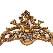 A large mirror in a gold frame, Italy, first half of the 20th century.