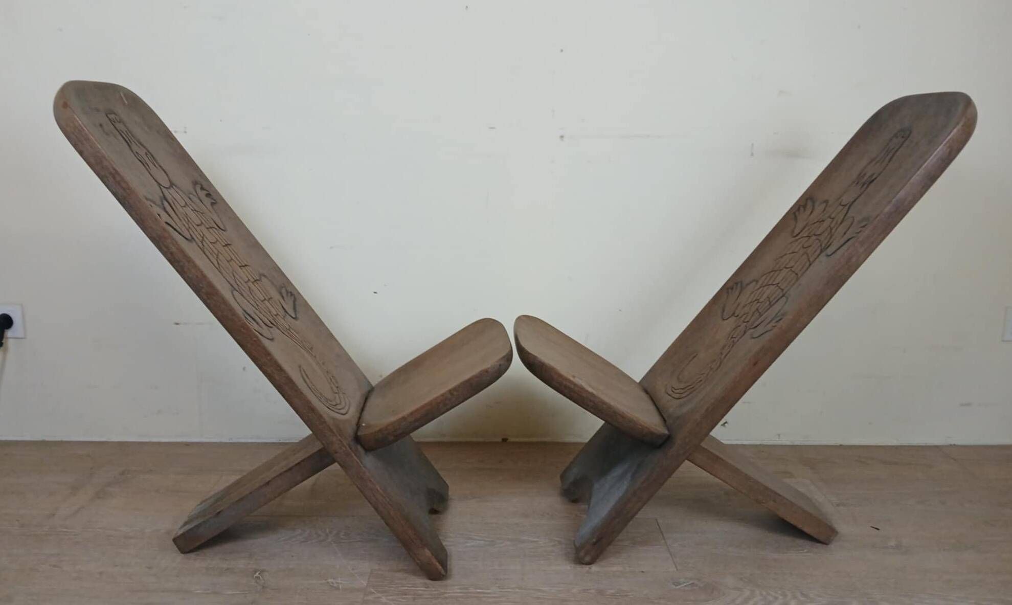 Central Africa circa 1950: pair of exotic wood chairs decorated with crocodile sculptures