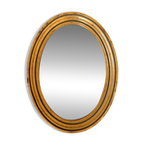 Old golden oval mirror