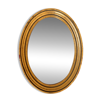 Old golden oval mirror