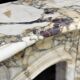 Louis XV style fireplace in purple breccia marble, circa 1880.