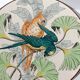 Plat rond à décor de perroquets dans la jungle, circa 1900