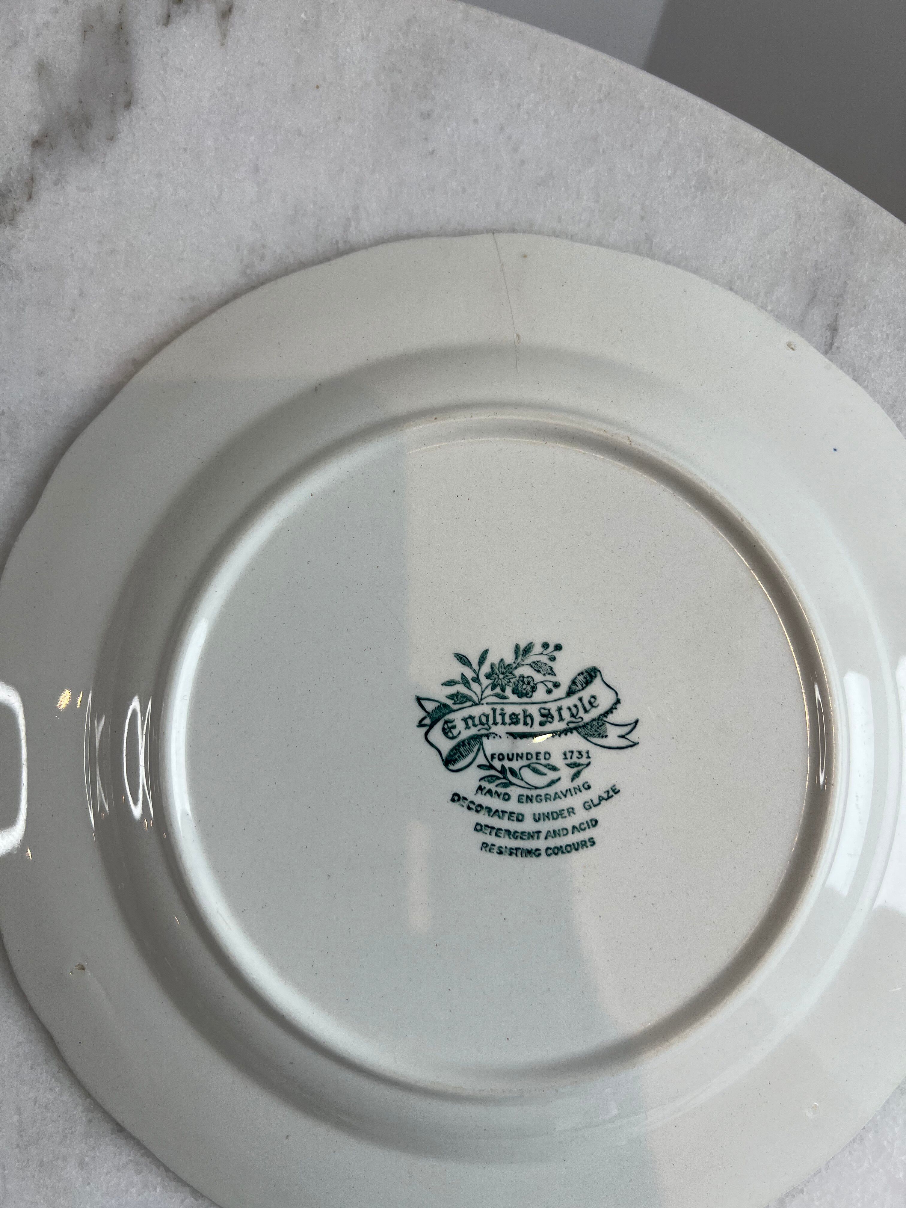 Set of four flat plates from English earthenware.