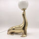 Vintage brass sea lion lamp
