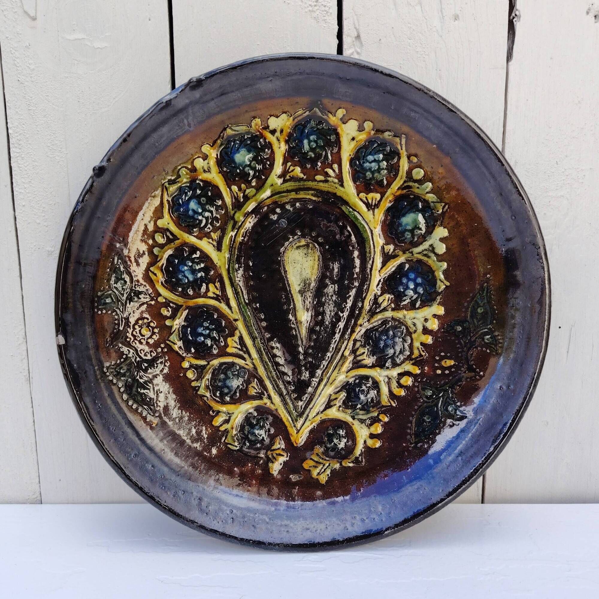 Decorative plate, glazed ceramic, floral design.