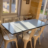 Blue Formica table for 4 to 6 people