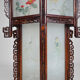 Asian wooden lantern carved with dragons and painted glass panels