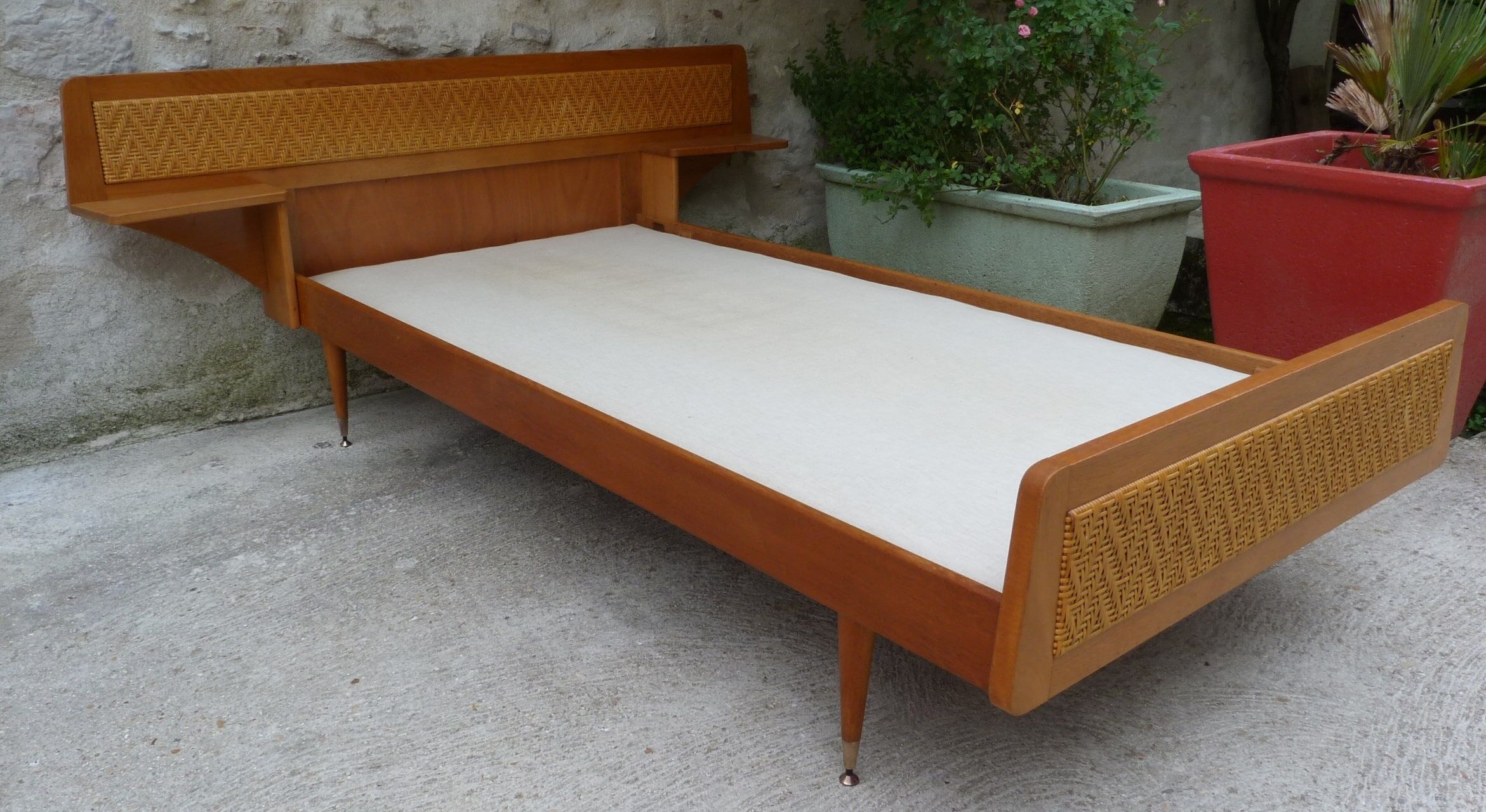 Wooden bed and rattan