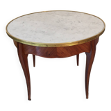 Coffee table with a veined white marble top