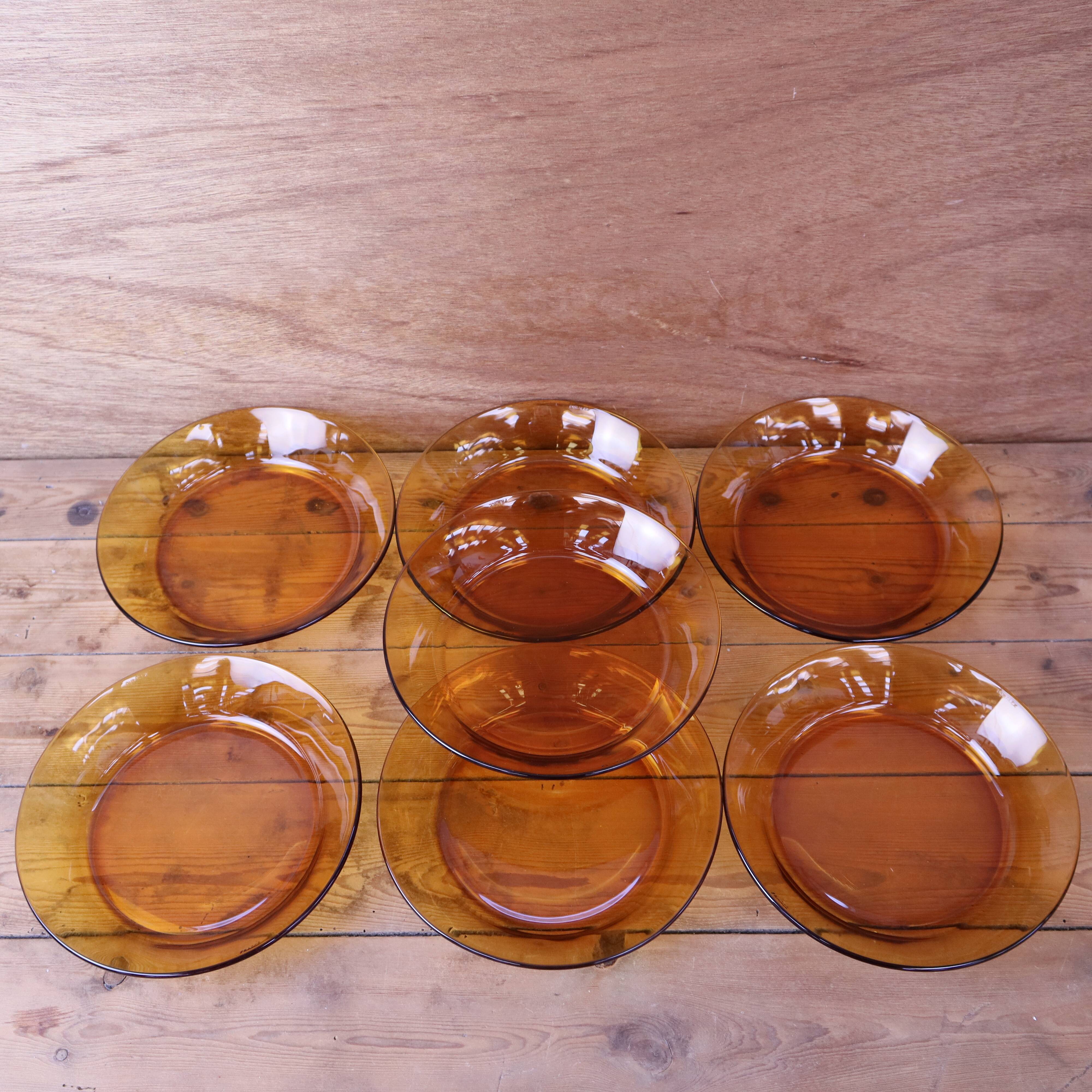 Set of 7 amber Duralex deep plates.
