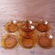 Set of 7 amber Duralex deep plates.