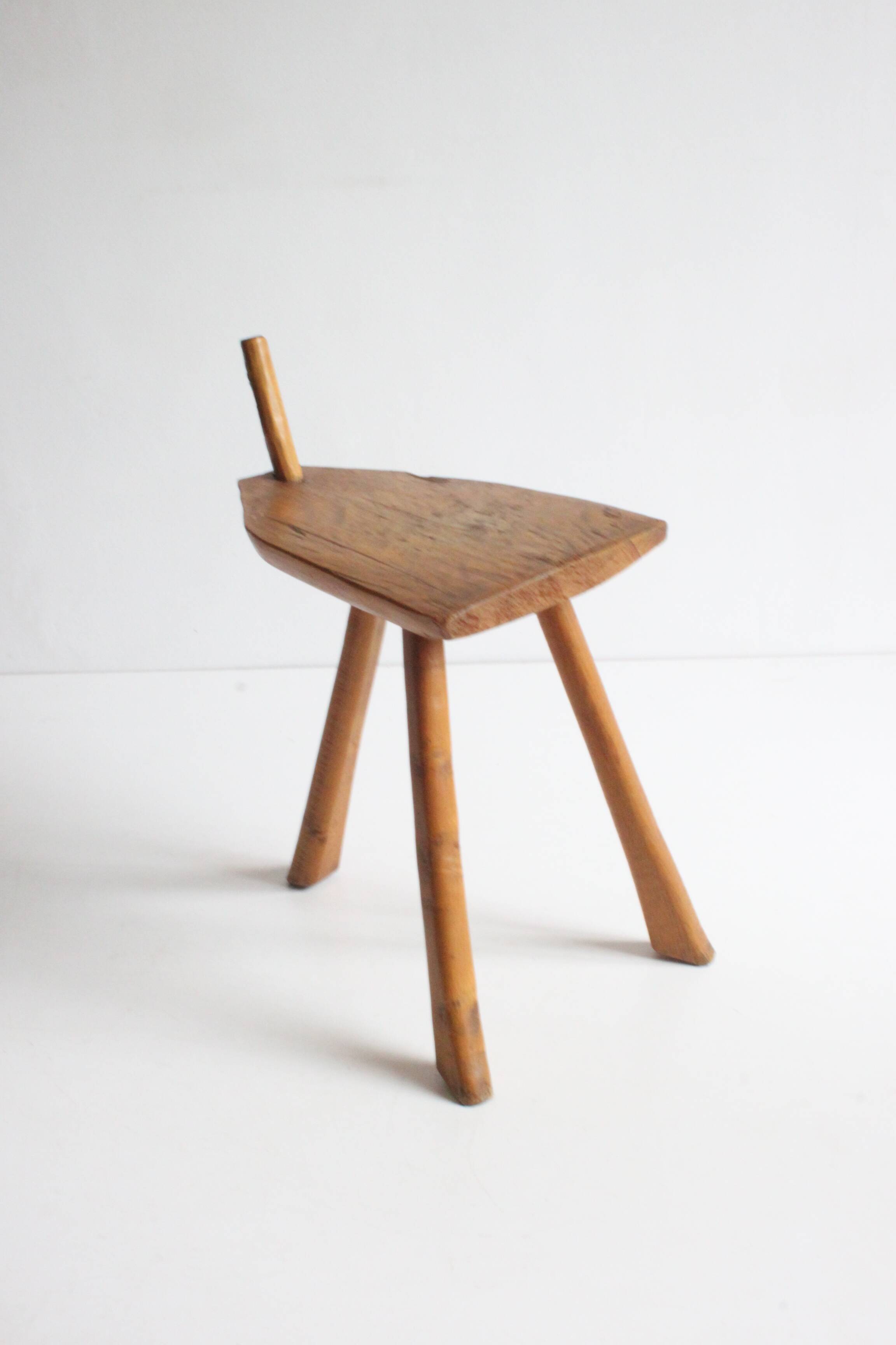 Brutalist tripod stool in carved wood, 1950s
