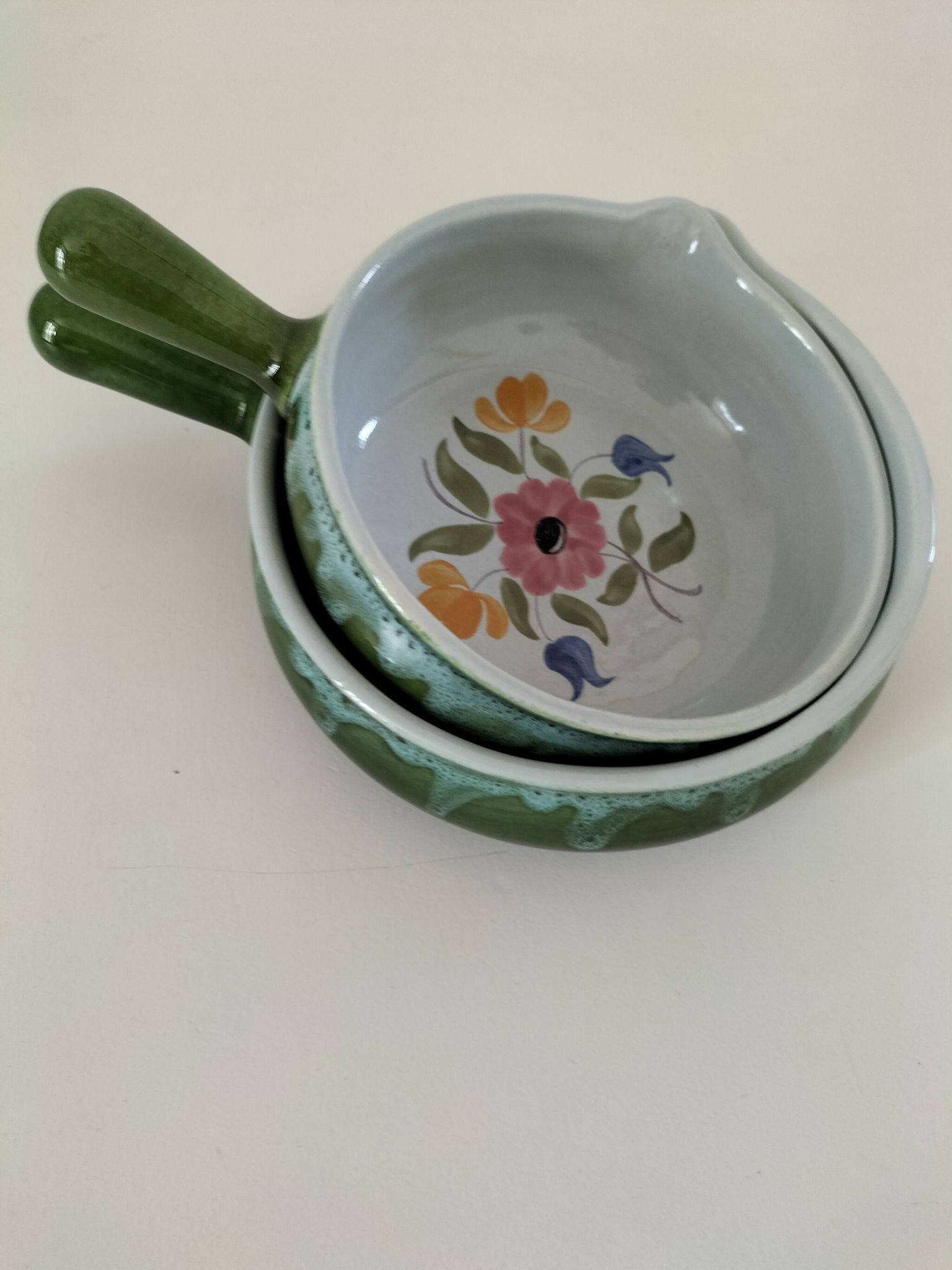 Duo of flowery caquelons