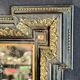 Napoleon III mirror in blackened wood and gilded decoration, second half of the 19th century.