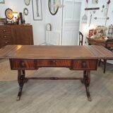 English desk in solid mahogany with lion paws. Leather top