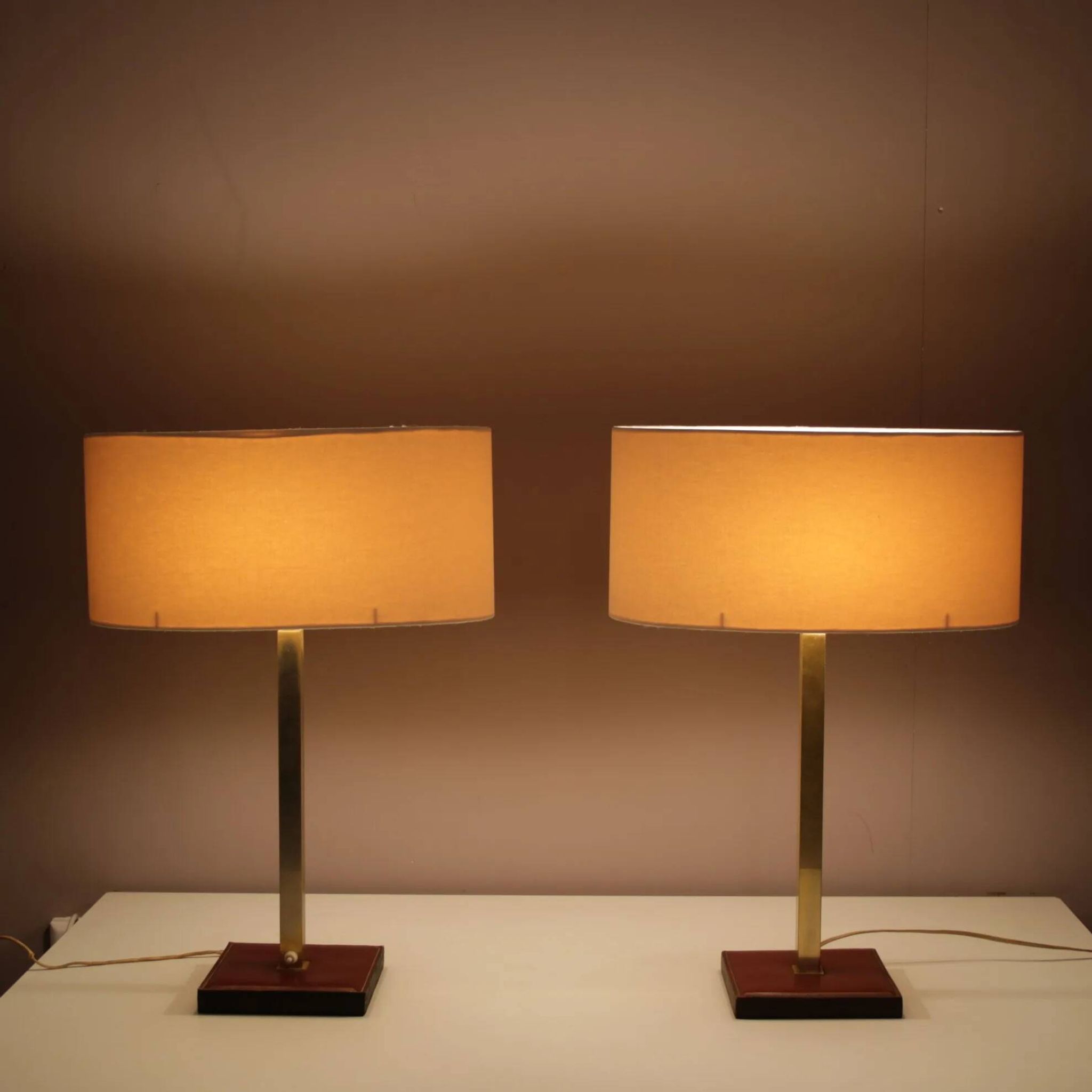 Pair of leather and brass table lamps from the 1960s, originating from Belgium.