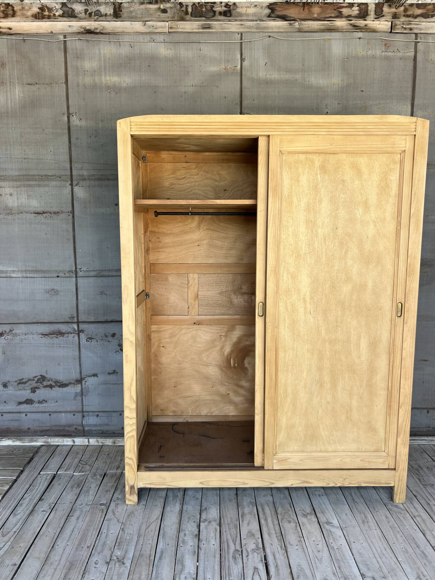 Sliding door wardrobe in raw wood