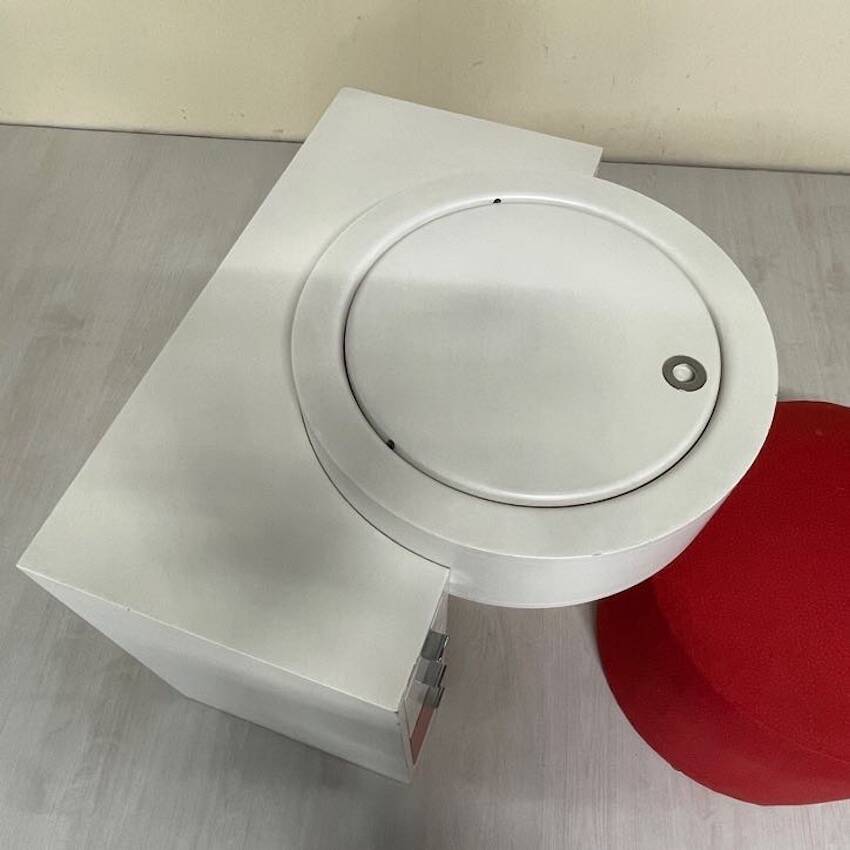 Bathroom toilet with a 70s pouf.