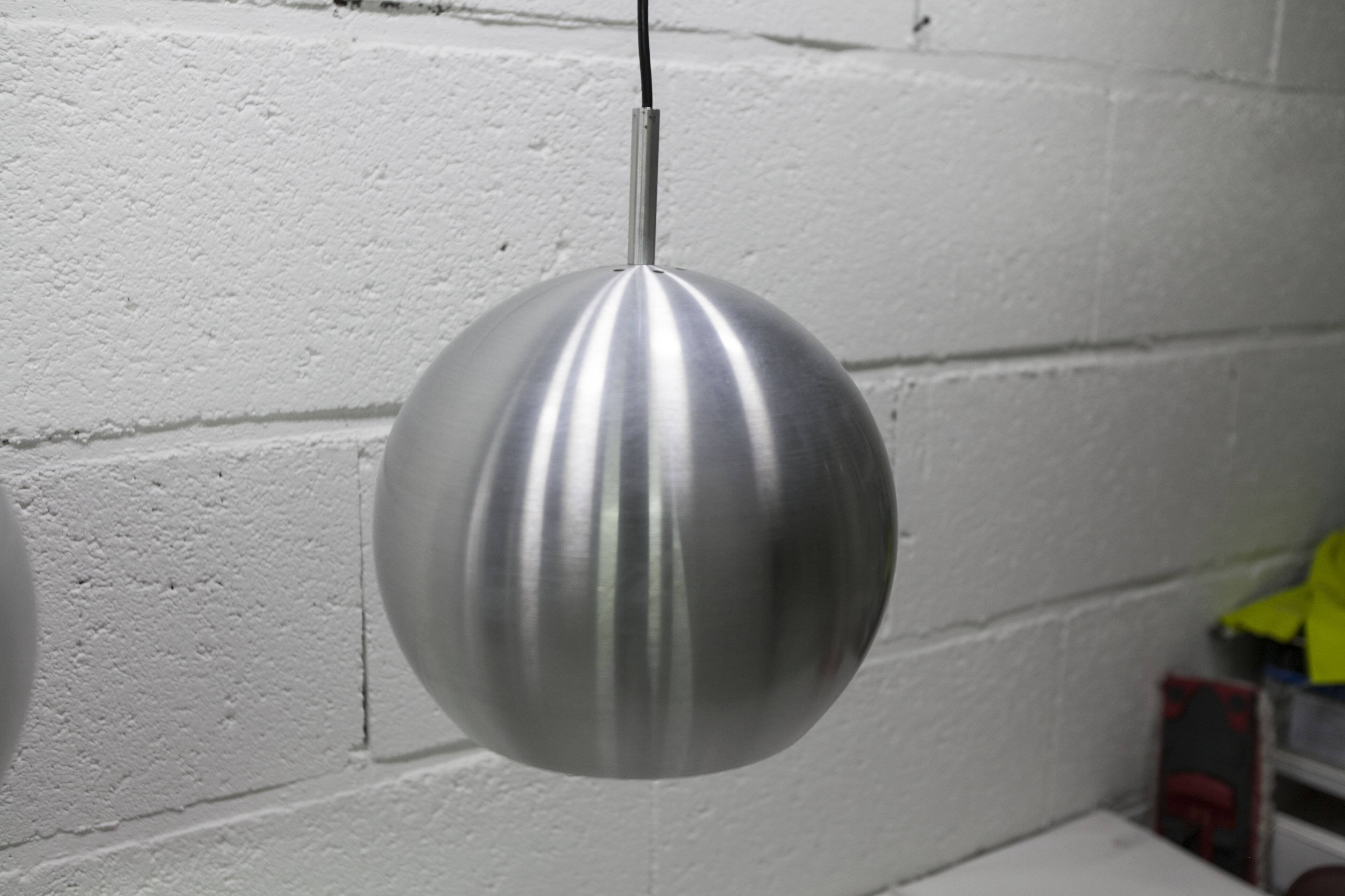 Pair of functional 70's aluminum ball pendants