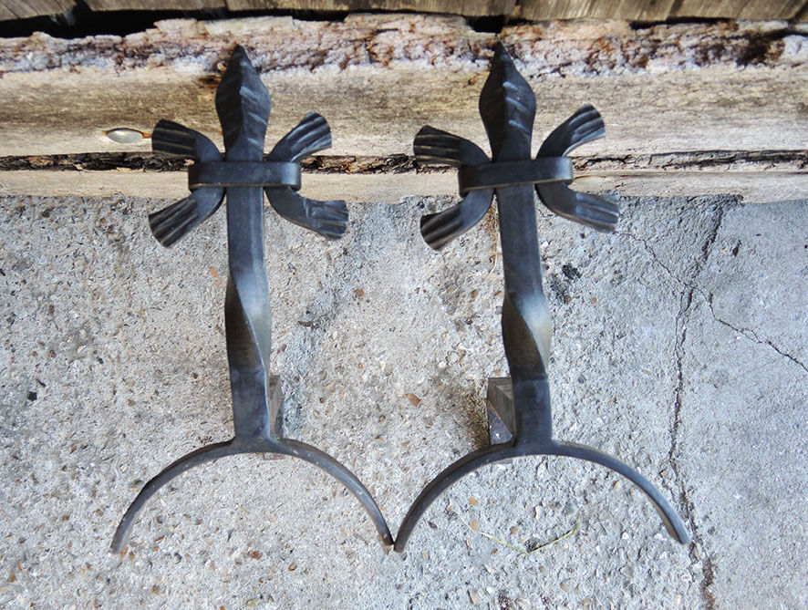 Old chenets fleur de lys in wrought iron