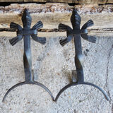 Old chenets fleur de lys in wrought iron
