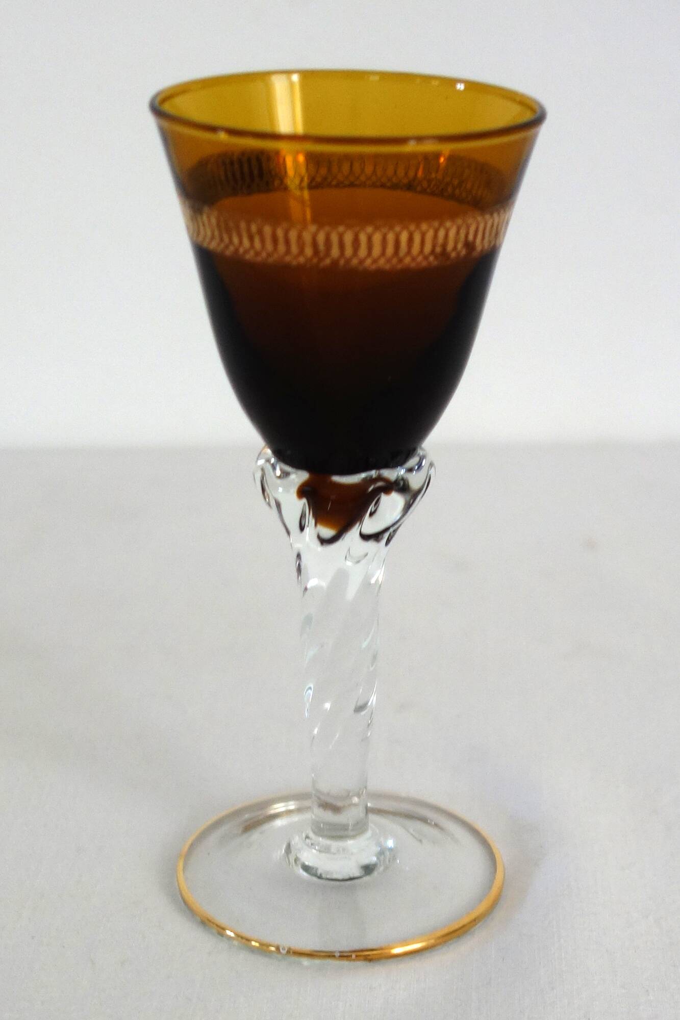 6 multicolored aperitif glasses with twisted legs