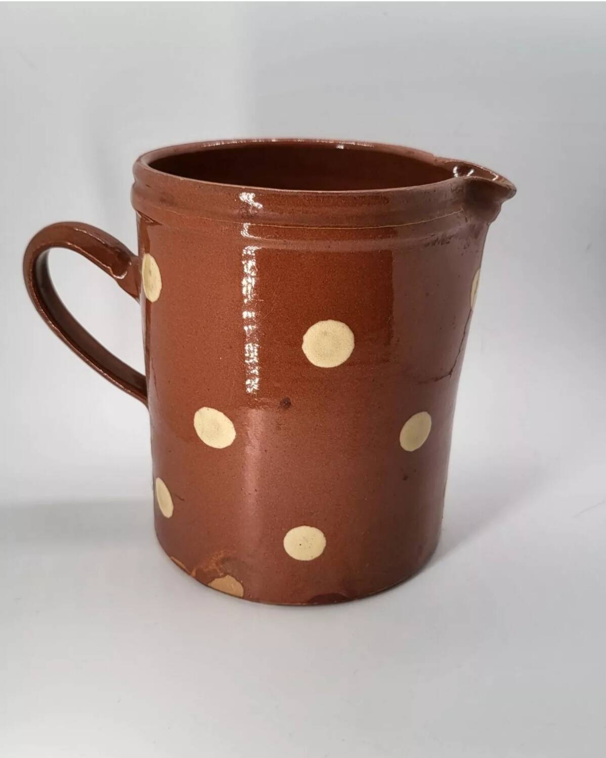Old pitcher with polka dots savoyard pottery in glazed terracotta alsace