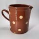 Old pitcher with polka dots savoyard pottery in glazed terracotta alsace
