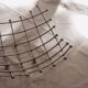 Curved grid fruit bowl, chrome metal and beads.
