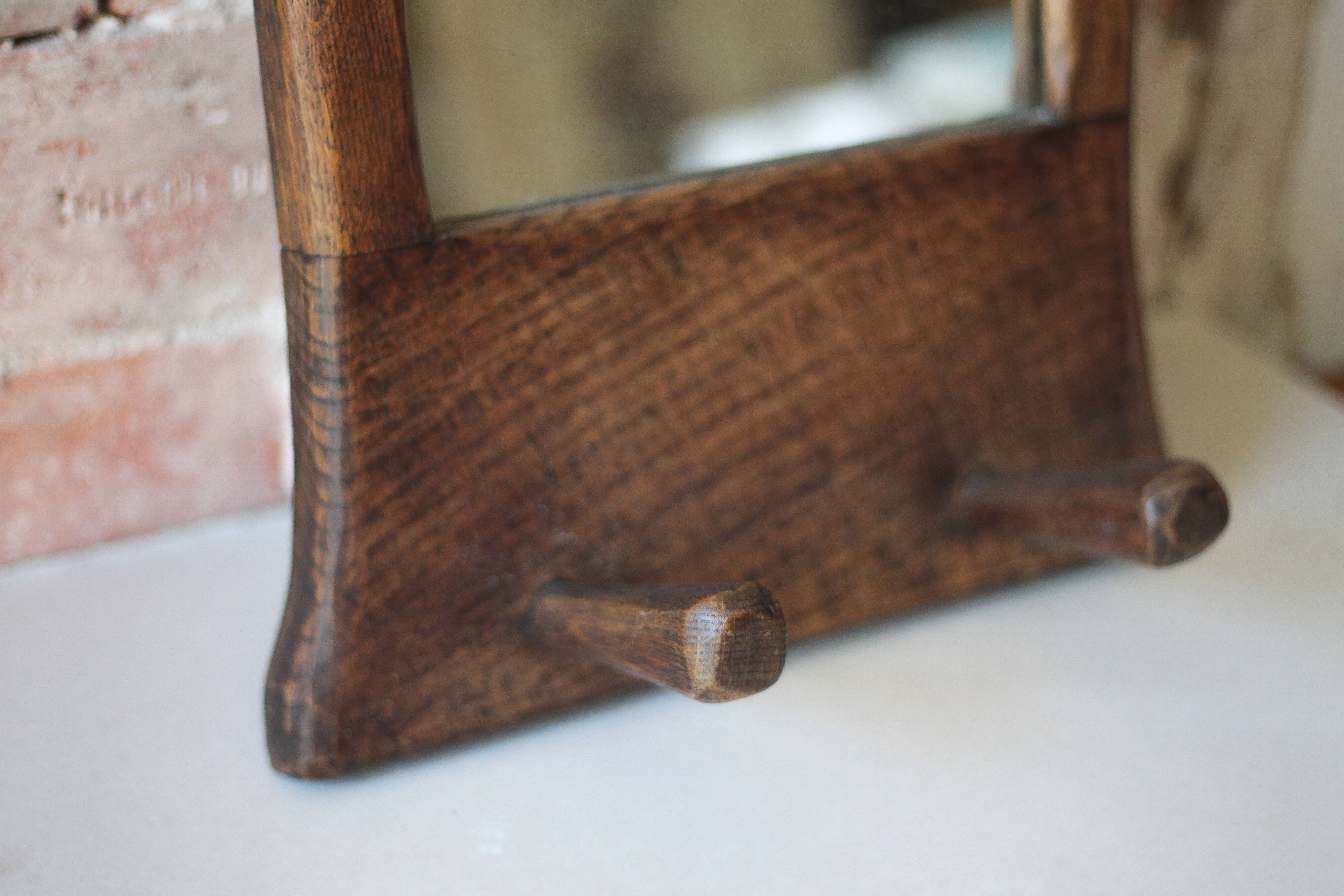 Wall-mounted coat rack mirror with solid wood hooks, brutalist mirror.
