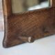 Wall-mounted coat rack mirror with solid wood hooks, brutalist mirror.
