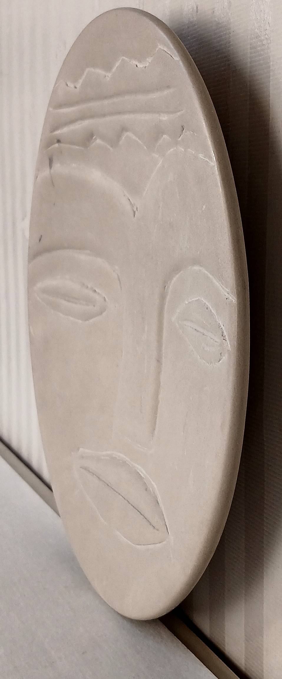 Plate "head with mask" natural stone hand carved