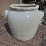 Old pot in beige sandstone.
