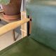 Galathée armchair in green leather, steel and ash wood