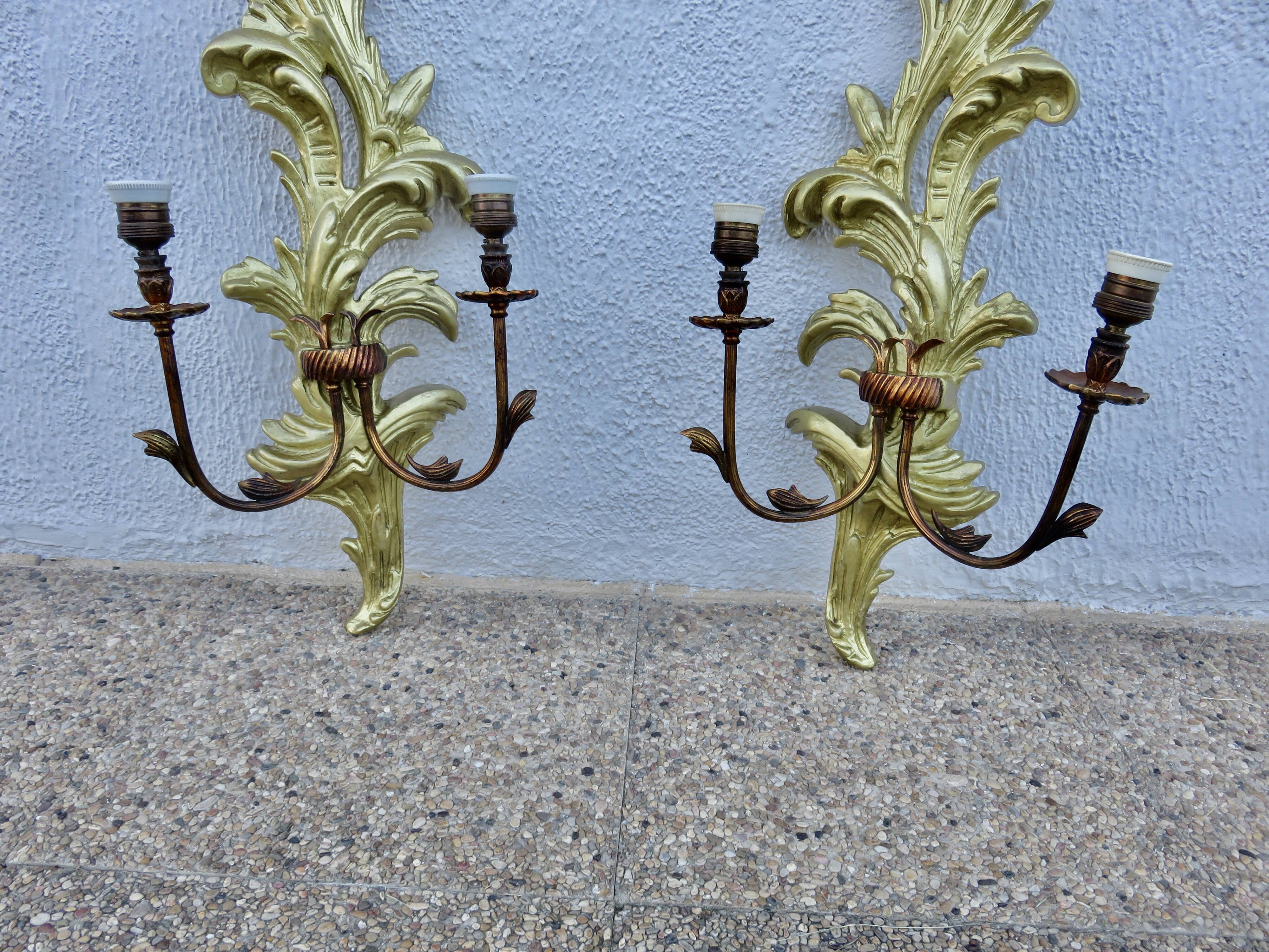 Pair of 86cm castle sconces in gilded wood from the 1940s