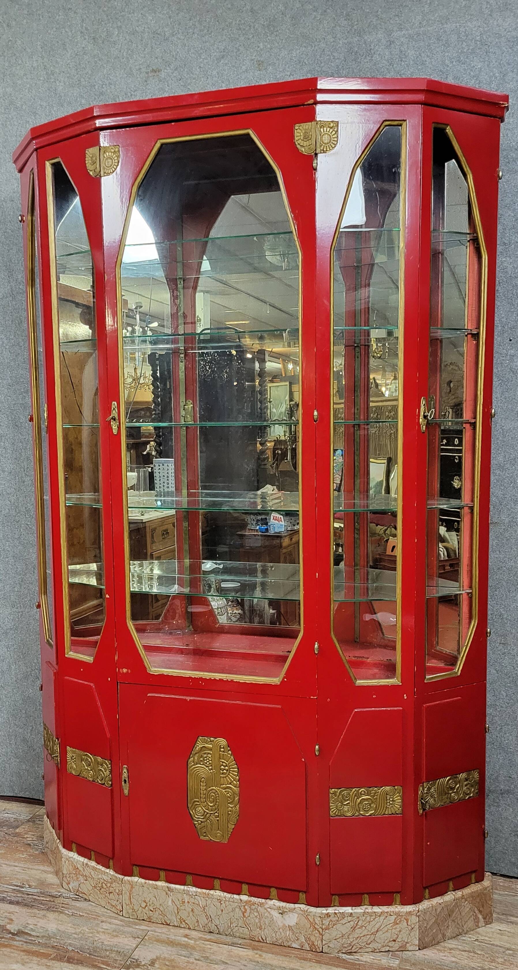 Important Art Deco period bookcase in lacquered wood and gilded bronze