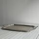 Silver metal serving tray with sculpted handles