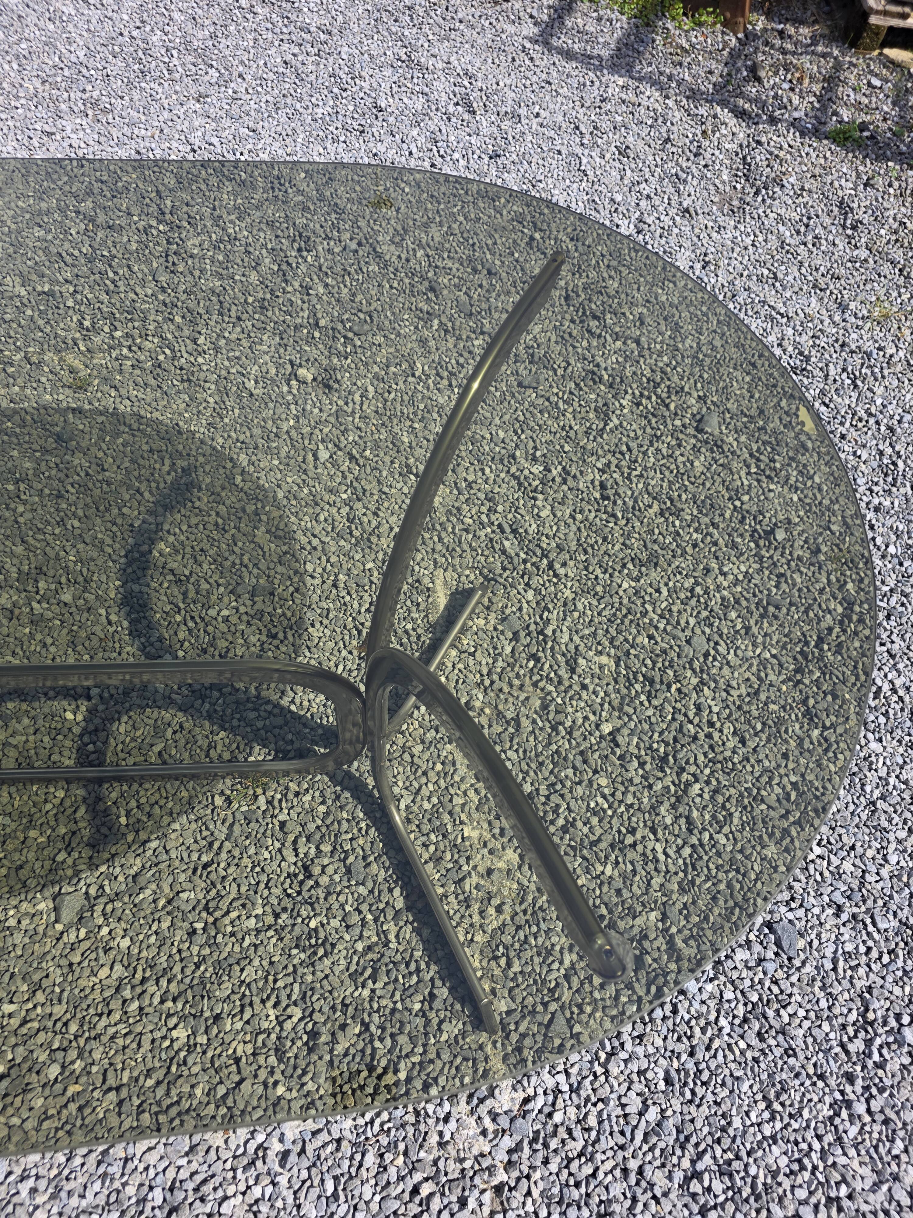 Silver metal table with smoked glass top from the 1970s.