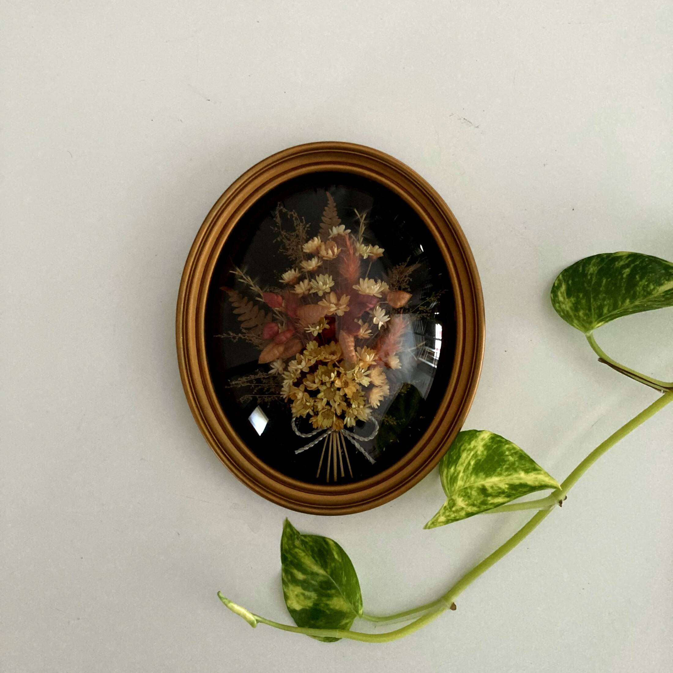 Small frame dried flowers under glass curved vintage imitation wood medallion