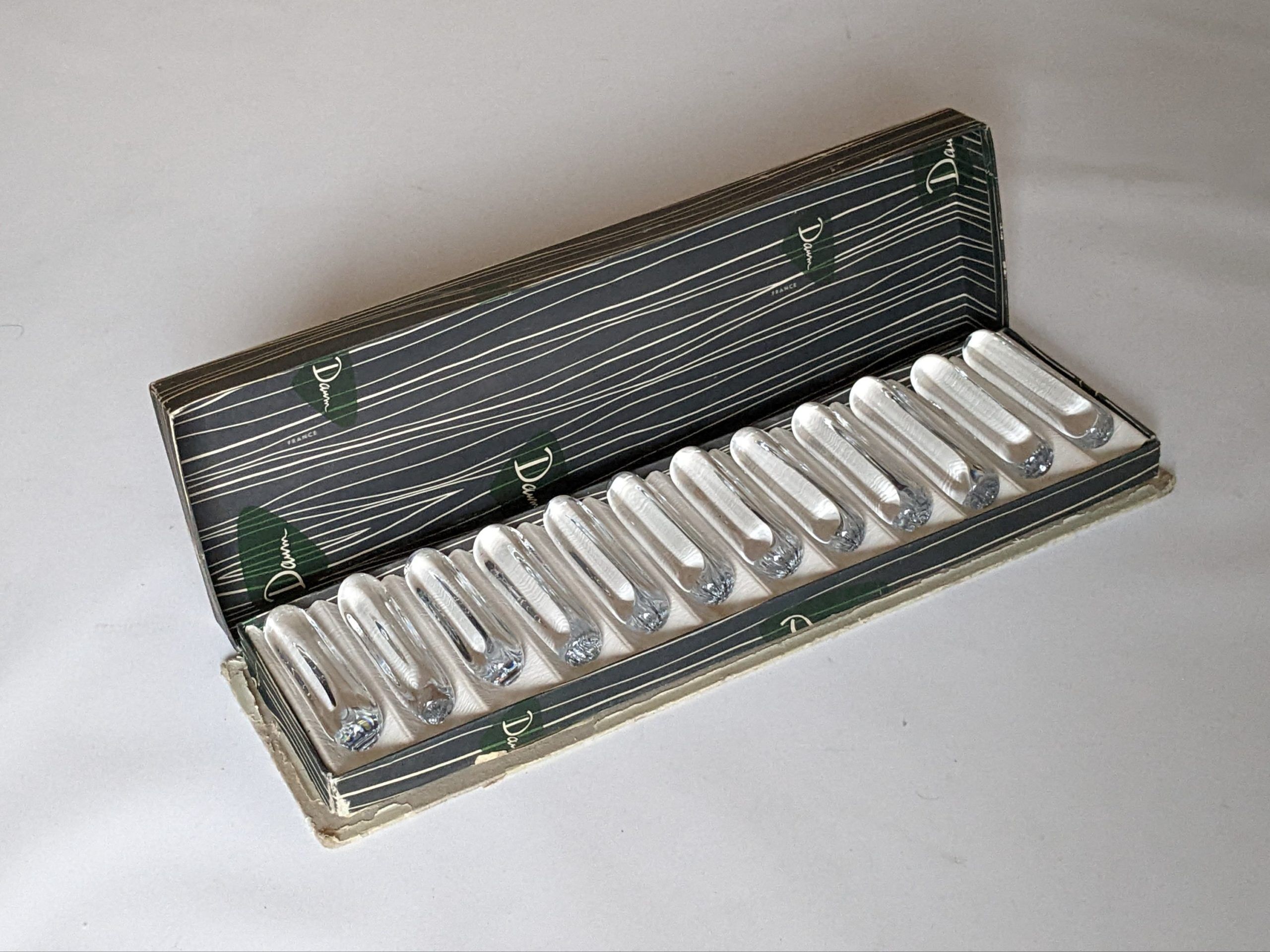 Suite of 12 Daum knife holders