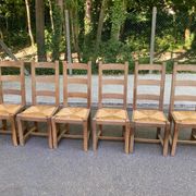 8 wooden dining chairs with straw seats, farmhouse style, high back.