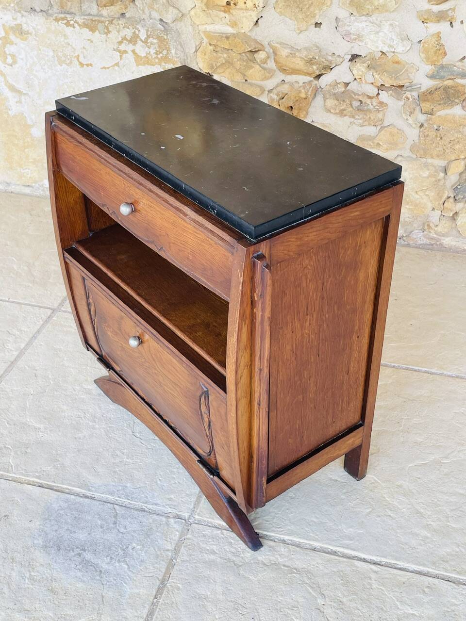 Art Deco bedside table in walnut, black marble top, circa 1920.