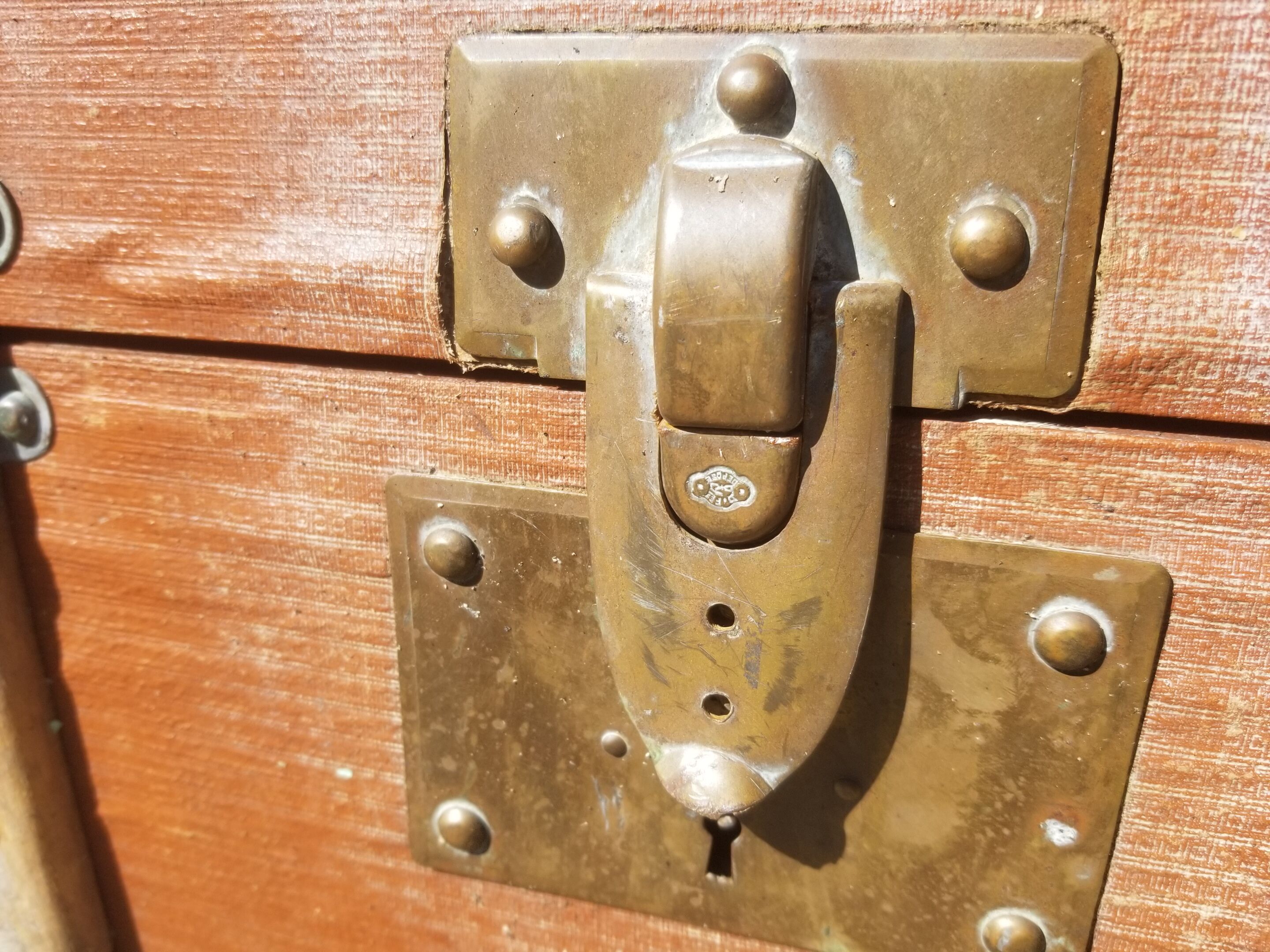 Old travel trunk made of wood and brass