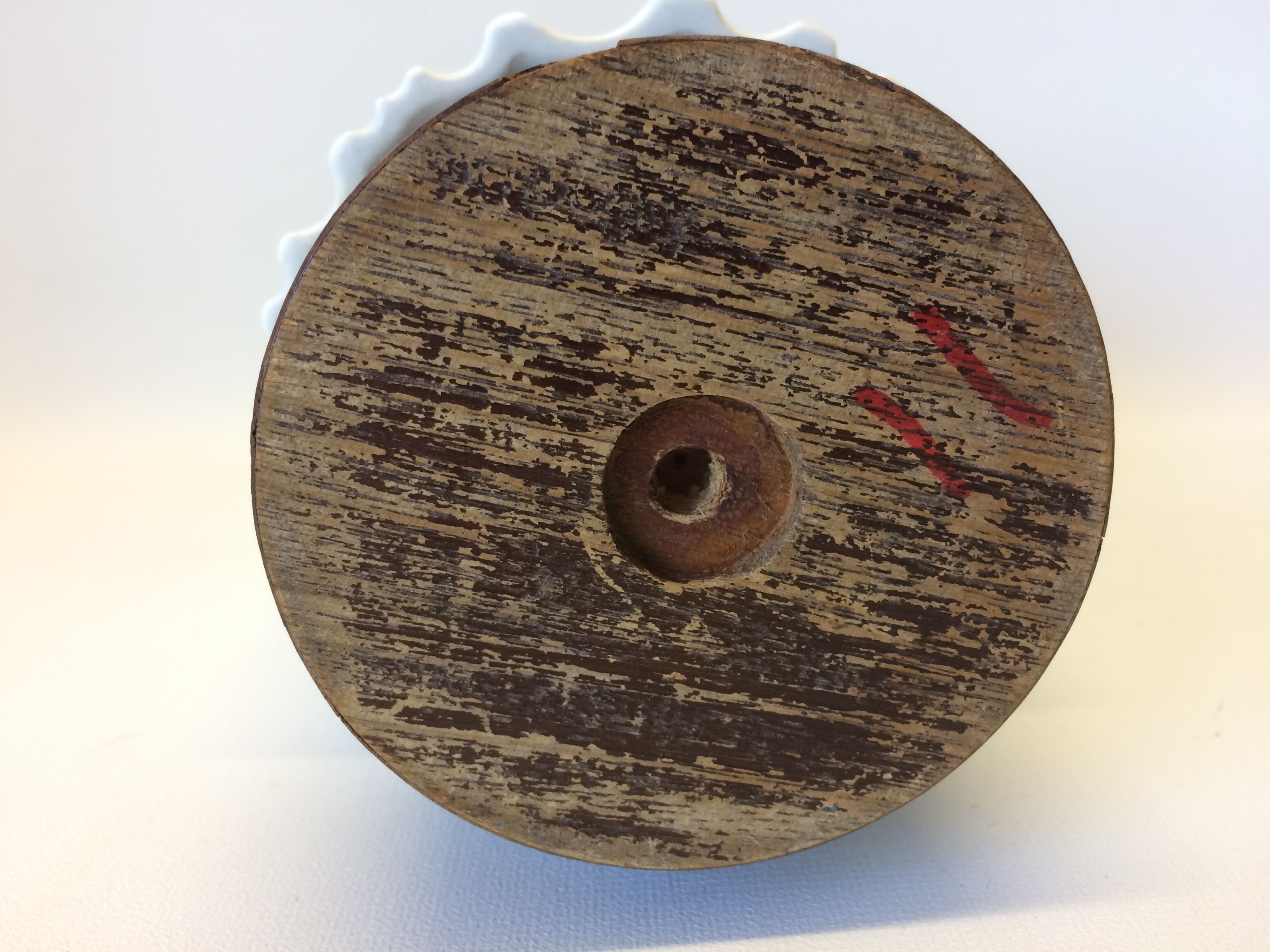 White vase on wooden base