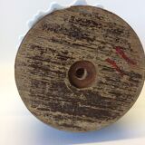 White vase on wooden base