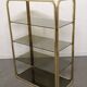 Hollywood Regency gilt metal and smoked glass shelf, Italy circa 1970