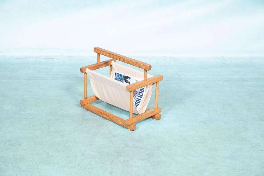 Bohemian magazine rack in vintage 70s pine style.