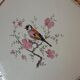 Trivet and bottle holder Salin, 1950s. Bird on branch.