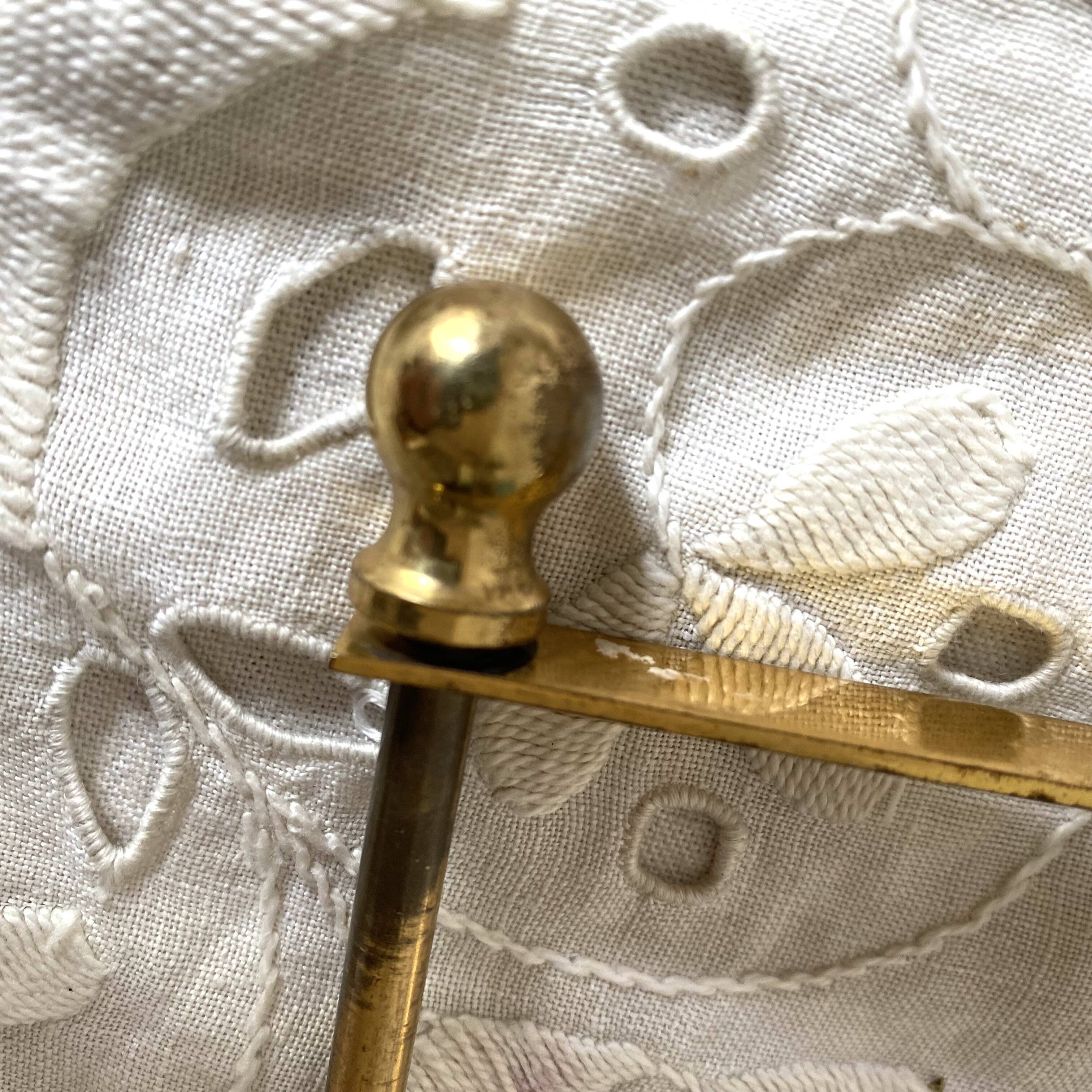 Swan toilet paper dispenser in brass