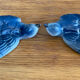 Old pair of porcelain birds for wall decoration.
